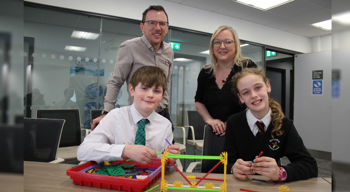 Gareth Kelly and Aine McGreegan with primary school children Aaron and Victoria